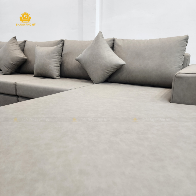 cận cảnh góc 1m8, màu da sofa và hệ gối tựa rời của sofa góc L bọc Simili.
